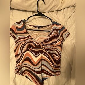 swirl patterned top